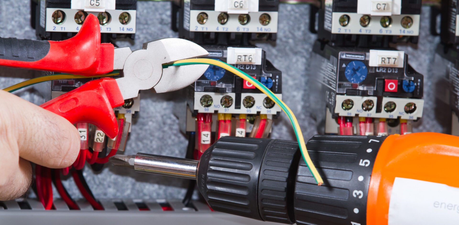 electrician at work with an electric panel electrician at work with an electric panel<br />